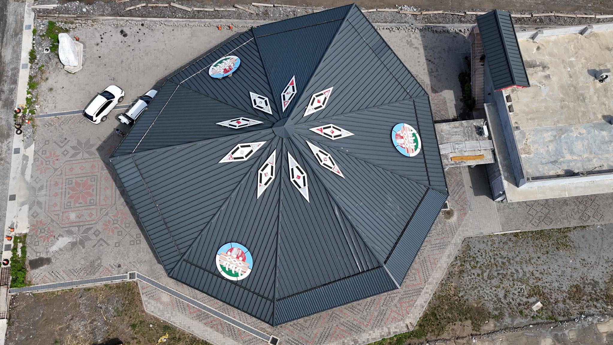 Overhead aerial view of the octagonal Matang Indigenous Tribal Gathering Place roof with Amis motif medallions, Taitung