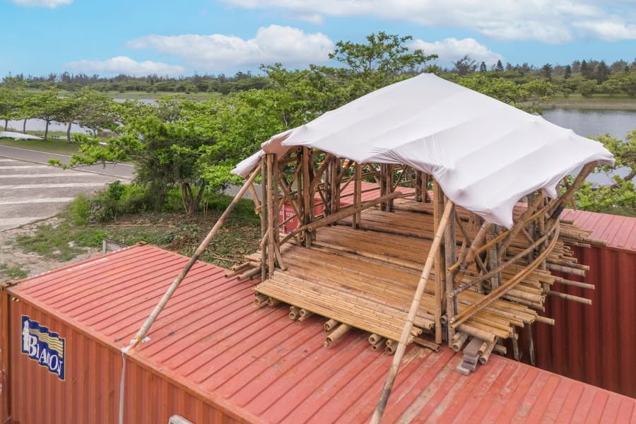 Pataminaan bamboo structure under construction atop shipping containers at Flowing Lake, Taitung Forest Park